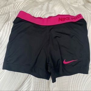 Black and pink Nike Pro shorts